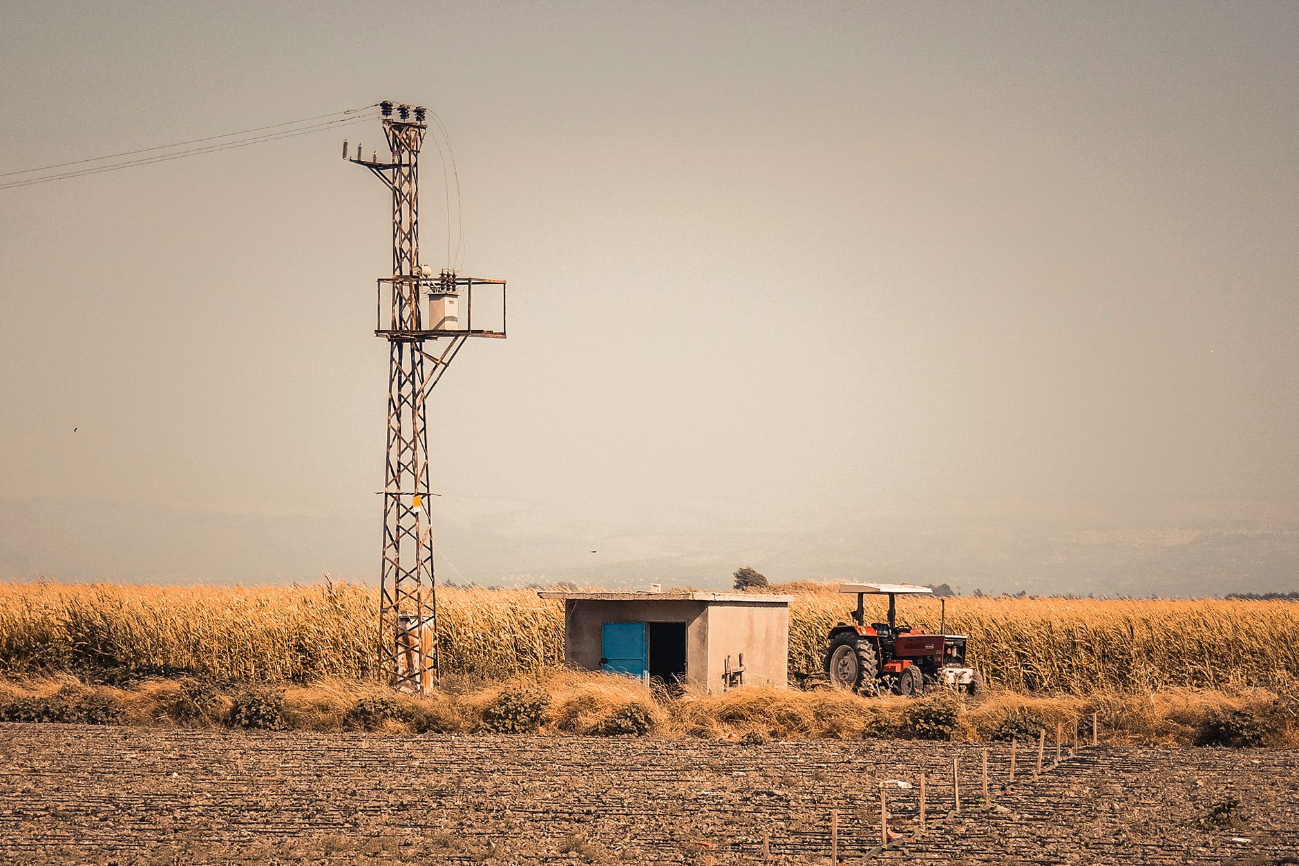 Rural Nevada high-desert land parcel with a manufactured home, golden hour